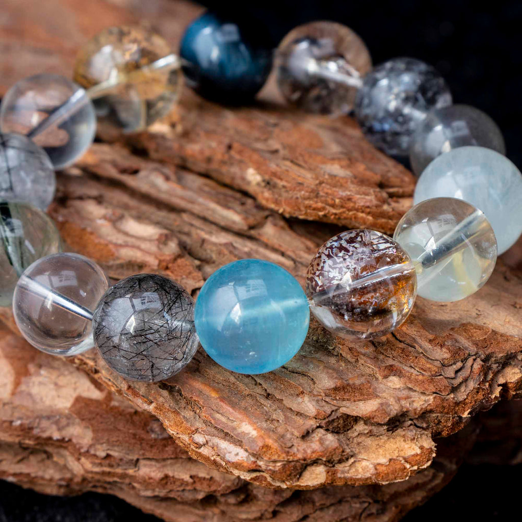 Auralyn Tarot The Chariot Growth & Flow Crystal Bracelet, 13–15mm Green & Black Rutilated Quartz with Clear Quartz, Gold-Foil Flower Agate, White Phantom, Aquamarine & Blue Tiger Eye, Handmade