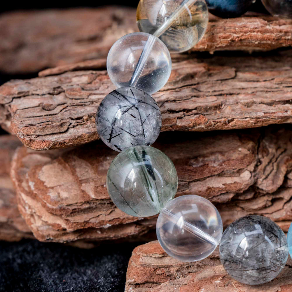 Auralyn Tarot The Chariot Growth & Flow Crystal Bracelet, 13–15mm Green & Black Rutilated Quartz with Clear Quartz, Gold-Foil Flower Agate, White Phantom, Aquamarine & Blue Tiger Eye, Handmade