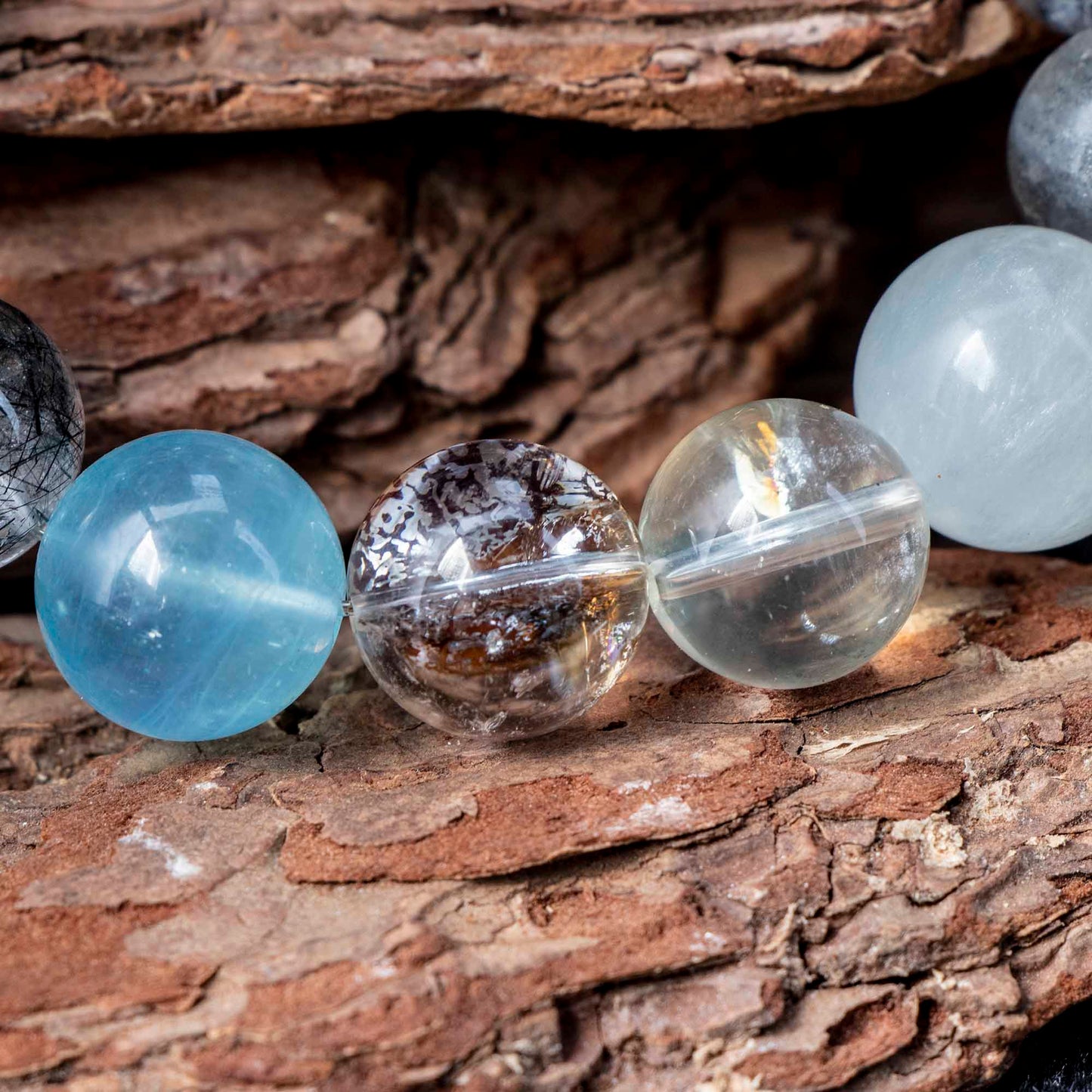 Auralyn Tarot The Chariot Growth & Flow Crystal Bracelet, 13–15mm Green & Black Rutilated Quartz with Clear Quartz, Gold-Foil Flower Agate, White Phantom, Aquamarine & Blue Tiger Eye, Handmade