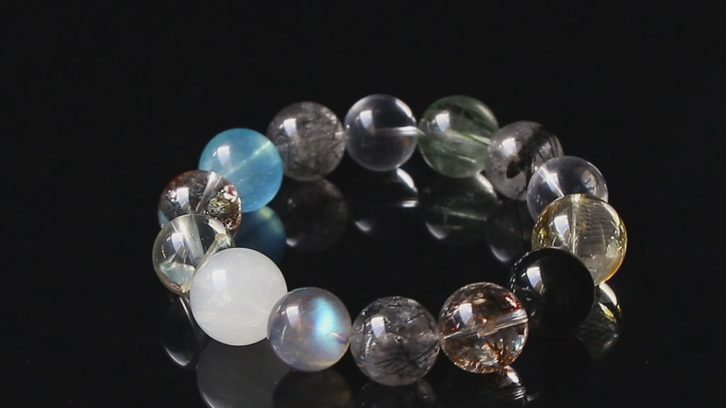 Auralyn Tarot The Chariot Growth & Flow Crystal Bracelet, 13–15mm Green & Black Rutilated Quartz with Clear Quartz, Gold-Foil Flower Agate, White Phantom, Aquamarine & Blue Tiger Eye, Handmade